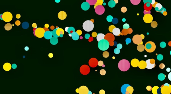 A scatter of colorful dots, particles rendered with nothing but CSS box-shadow.