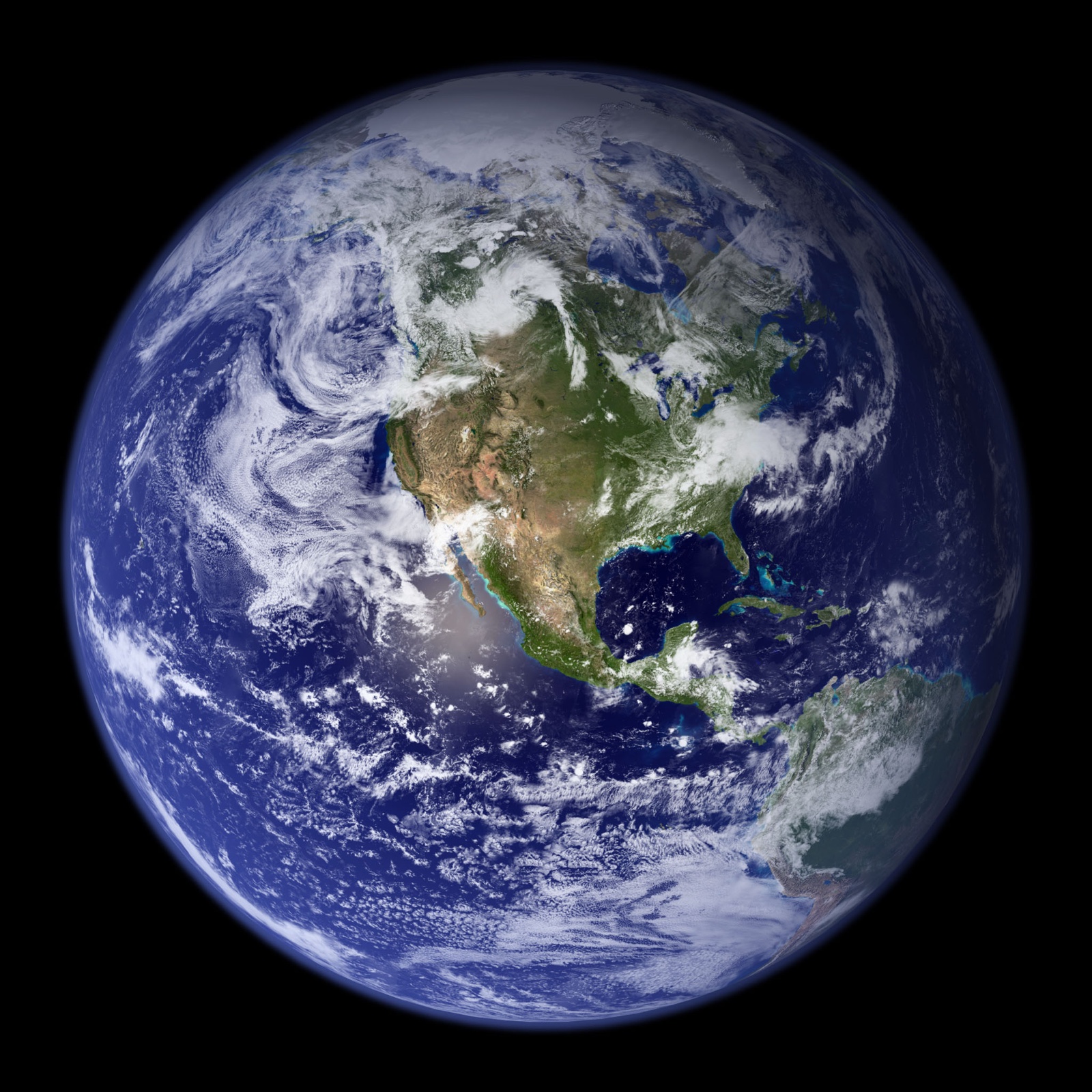 Earth as a full disk from space, the Blue Marble: deep blue ocean and white cloud over the Americas.